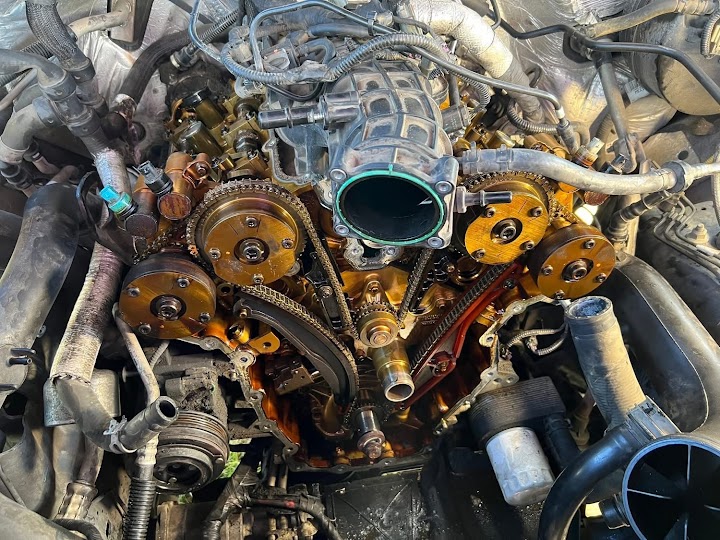 Technician using diagnostic tools on a vehicle
